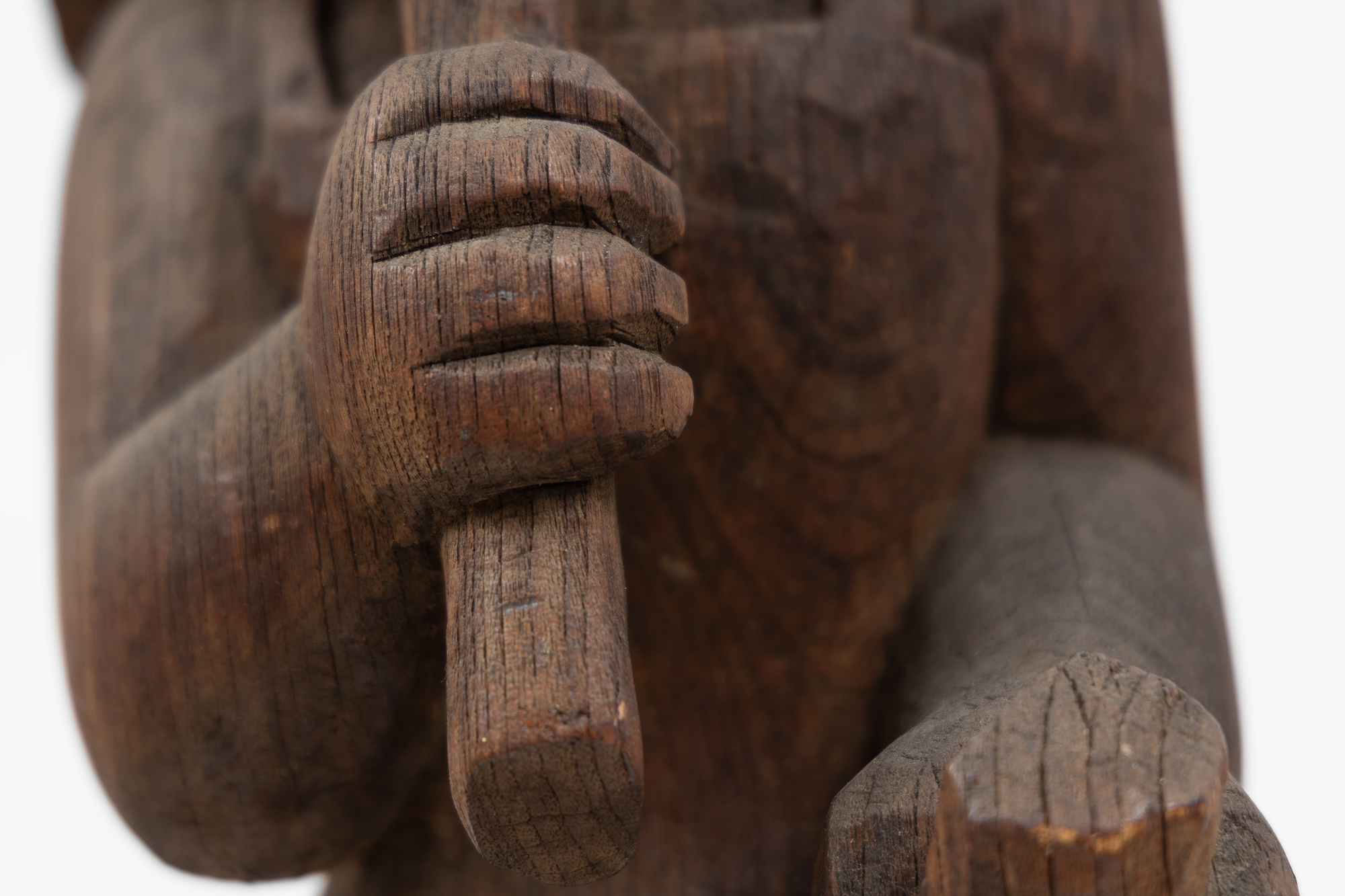 After disappointing sales at Weyhe Gallery in 1928, Calder turned from sculpted wire portraits and figures to the more conventional medium of wood. On the advice of sculptor Chaim Gross, he purchased small blocks of wood from Monteath, a Brooklyn supplier of tropical woods. He spent much of that summer on a Peekskill, New York farm carving. In each case, the woodblock suggested how he might preserve its overall shape and character as he subsumed those attributes in a single form.  There was a directness about working in wood that appealed to him. Carved from a single block of wood, Woman with Square Umbrella is not very different from the subjects of his wire sculptures except that he supplanted the ethereal nature of using wire with a more corporeal medium.
<br>© 2023 Calder Foundation, New York / Artists Rights Society (ARS), New York