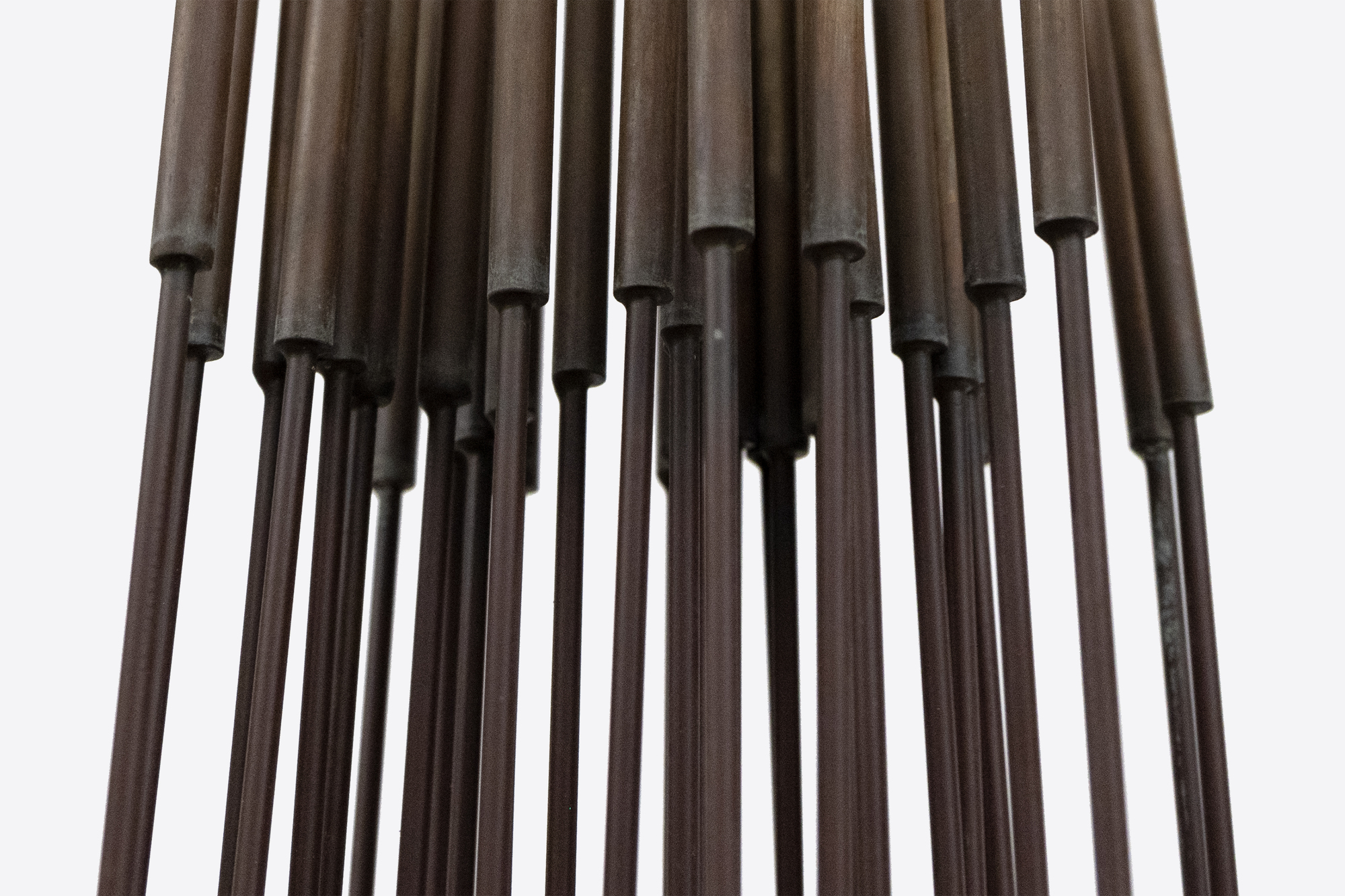 <div><font face=Calibri size=3 color=black>Harry Bertoia’s “Sonambient” sculptures are a mesmerizing blend of art, sound, and science, and this 36-tine piece is a quintessential example of his innovative genius. Meticulously crafted with 36 rods aligned in a precise six-by-six configuration on a square base, this 77-inch-tall work embodies the harmonious intersection of visual beauty and auditory wonder.</font></div>
<br>
<br><div> </div>
<br>
<br><div><font face=Calibri size=3 color=black>Made from beryllium copper, a material favored by Bertoia for its superior acoustic properties and aesthetic appeal, the rods have developed a rich walnut-like patina over time. This patina adds to the sculpture’s visual allure, enhancing its historical and artistic value, and reflects a natural aging process that the artist himself, a naturalist, would have admired. When activated by touch or the movement of air, the rods produce a perceptible, fixed note accompanied by a range of ethereal tones, transforming the sculpture from a static object into a dynamic, multisensory experience. The long, swaying motion of the tall rods, reminiscent of the undulating desert grasses that inspired the artist initially, adds a captivating visual dimension. The cattail-like finials further evoke natural forms, underscoring Bertoia’s inspiration derived from the natural world.</font></div>
<br>
<br><div> </div>
<br>
<br><div><font face=Calibri size=3 color=black>Bertoia’s 36-tine “Sonambient” sculpture is more than a visual masterpiece; it profoundly explores sound, material, and participatory interaction. It exemplifies Bertoia’s belief in art as an immersive and evolving experience, where each encounter offers discoveries and sensations. Through this work, Bertoia has created a timeless piece that continues to captivate and inspire, highlighting his artistic vision's enduring power and deep connection to nature’s spiritual qualities.</font></div>