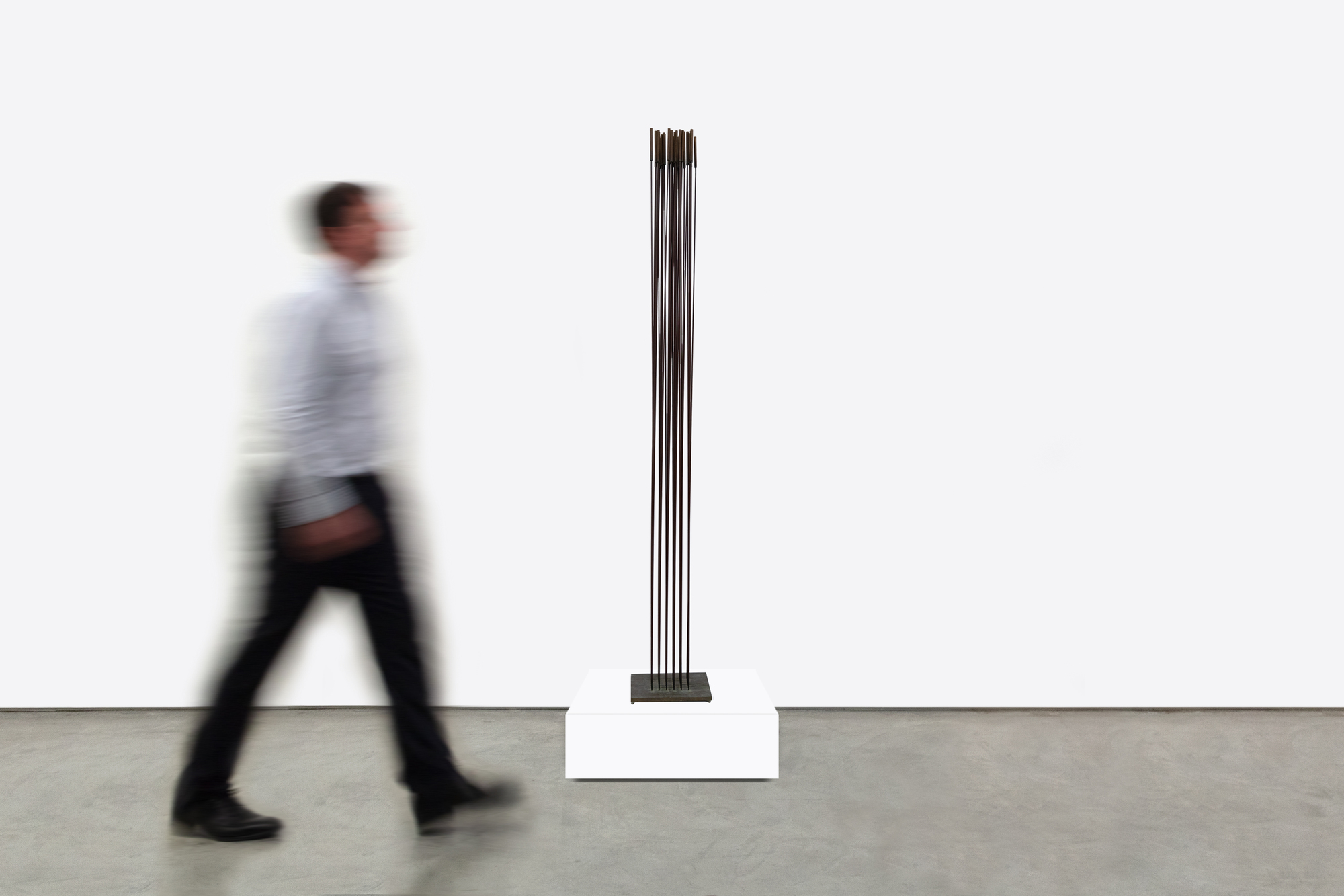 <div><font face=Calibri size=3 color=black>Harry Bertoia’s “Sonambient” sculptures are a mesmerizing blend of art, sound, and science, and this 36-tine piece is a quintessential example of his innovative genius. Meticulously crafted with 36 rods aligned in a precise six-by-six configuration on a square base, this 77-inch-tall work embodies the harmonious intersection of visual beauty and auditory wonder.</font></div>
<br>
<br><div> </div>
<br>
<br><div><font face=Calibri size=3 color=black>Made from beryllium copper, a material favored by Bertoia for its superior acoustic properties and aesthetic appeal, the rods have developed a rich walnut-like patina over time. This patina adds to the sculpture’s visual allure, enhancing its historical and artistic value, and reflects a natural aging process that the artist himself, a naturalist, would have admired. When activated by touch or the movement of air, the rods produce a perceptible, fixed note accompanied by a range of ethereal tones, transforming the sculpture from a static object into a dynamic, multisensory experience. The long, swaying motion of the tall rods, reminiscent of the undulating desert grasses that inspired the artist initially, adds a captivating visual dimension. The cattail-like finials further evoke natural forms, underscoring Bertoia’s inspiration derived from the natural world.</font></div>
<br>
<br><div> </div>
<br>
<br><div><font face=Calibri size=3 color=black>Bertoia’s 36-tine “Sonambient” sculpture is more than a visual masterpiece; it profoundly explores sound, material, and participatory interaction. It exemplifies Bertoia’s belief in art as an immersive and evolving experience, where each encounter offers discoveries and sensations. Through this work, Bertoia has created a timeless piece that continues to captivate and inspire, highlighting his artistic vision's enduring power and deep connection to nature’s spiritual qualities.</font></div>