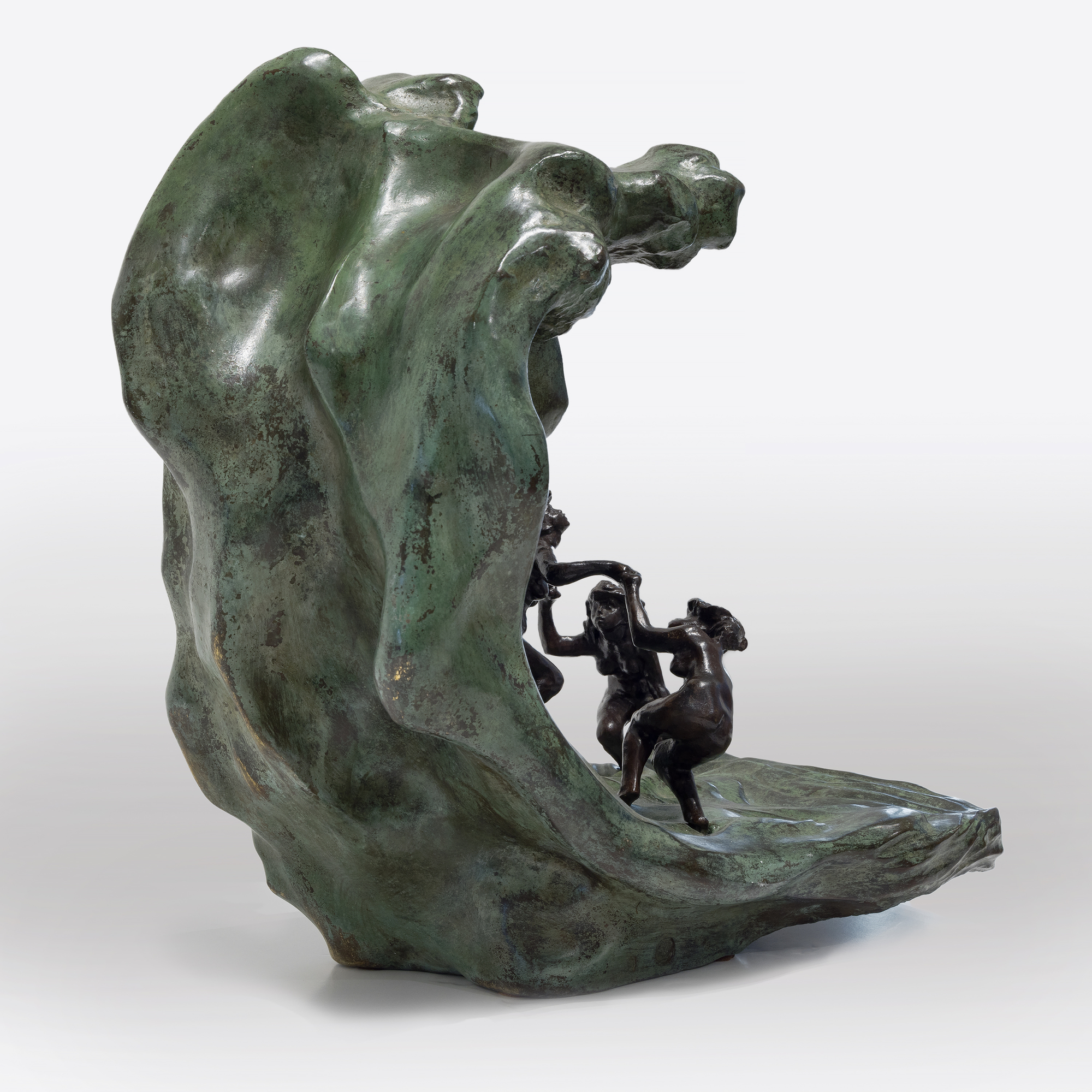 <div><font face=Calibri size=3 color=black>Camille Claudel's life story reflects an era when societal constraints often dimmed the brilliance of women; their genius was viewed as a threat to the male-dominated world. Most introductions to Claudel are steeped in misleading biographical details related to her as Rodin's assistant, mistress, or lover, associations that diminish her achievements as a first-rate sculptor whose work borrows little from Rodin in style or subject matter. Despite these challenges, Claudel's legacy has endured, celebrated through exhibitions, biographies, and films since her rediscovery in 1982. </font></div>
<br>
<br><div> </div>
<br>
<br><div><font face=Calibri size=3 color=black><em>“La Vague (The Wave),”</em> a remarkable sculpture of three women frolicking joyfully, embodies Claudel's passion for art and connection to nature. The women, their hair unruly like the sea, are depicted in a moment of freedom and abandon, yet the looming wave hints at the inevitable sorrow to come—a metaphor for Claudel's life, shadowed by fate. This piece, initially shown in plaster and later cast in bronze with an onyx marble wave, draws direct inspiration from Hokusai's <em>“The Great Wave,”</em> reflecting the Parisian fascination with Japanese art at the time. While <em>“La Vague”</em> showcases Claudel's technical mastery and the influence of Japanese aesthetics, it also poignantly symbolizes her acceptance of the overpowering forces of nature and the tragic course her life would ultimately take. This bronze, cast in 1997, is one of only two not held in a museum, further emphasizing the rarity of and reverence for Claudel's work.</font></div>