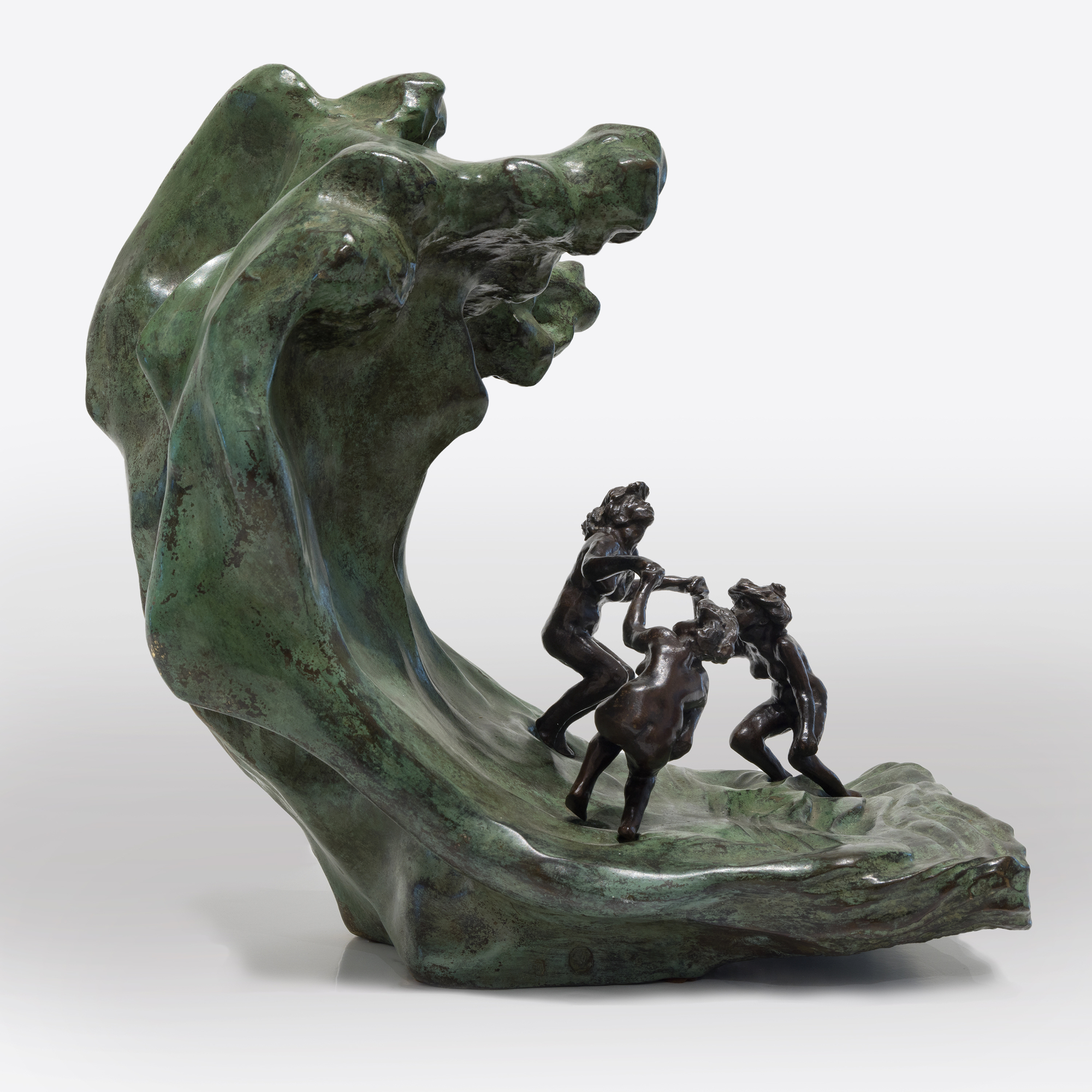 <div><font face=Calibri size=3 color=black>Camille Claudel's life story reflects an era when societal constraints often dimmed the brilliance of women; their genius was viewed as a threat to the male-dominated world. Most introductions to Claudel are steeped in misleading biographical details related to her as Rodin's assistant, mistress, or lover, associations that diminish her achievements as a first-rate sculptor whose work borrows little from Rodin in style or subject matter. Despite these challenges, Claudel's legacy has endured, celebrated through exhibitions, biographies, and films since her rediscovery in 1982. </font></div>
<br>
<br><div> </div>
<br>
<br><div><font face=Calibri size=3 color=black><em>“La Vague (The Wave),”</em> a remarkable sculpture of three women frolicking joyfully, embodies Claudel's passion for art and connection to nature. The women, their hair unruly like the sea, are depicted in a moment of freedom and abandon, yet the looming wave hints at the inevitable sorrow to come—a metaphor for Claudel's life, shadowed by fate. This piece, initially shown in plaster and later cast in bronze with an onyx marble wave, draws direct inspiration from Hokusai's <em>“The Great Wave,”</em> reflecting the Parisian fascination with Japanese art at the time. While <em>“La Vague”</em> showcases Claudel's technical mastery and the influence of Japanese aesthetics, it also poignantly symbolizes her acceptance of the overpowering forces of nature and the tragic course her life would ultimately take. This bronze, cast in 1997, is one of only two not held in a museum, further emphasizing the rarity of and reverence for Claudel's work.</font></div>