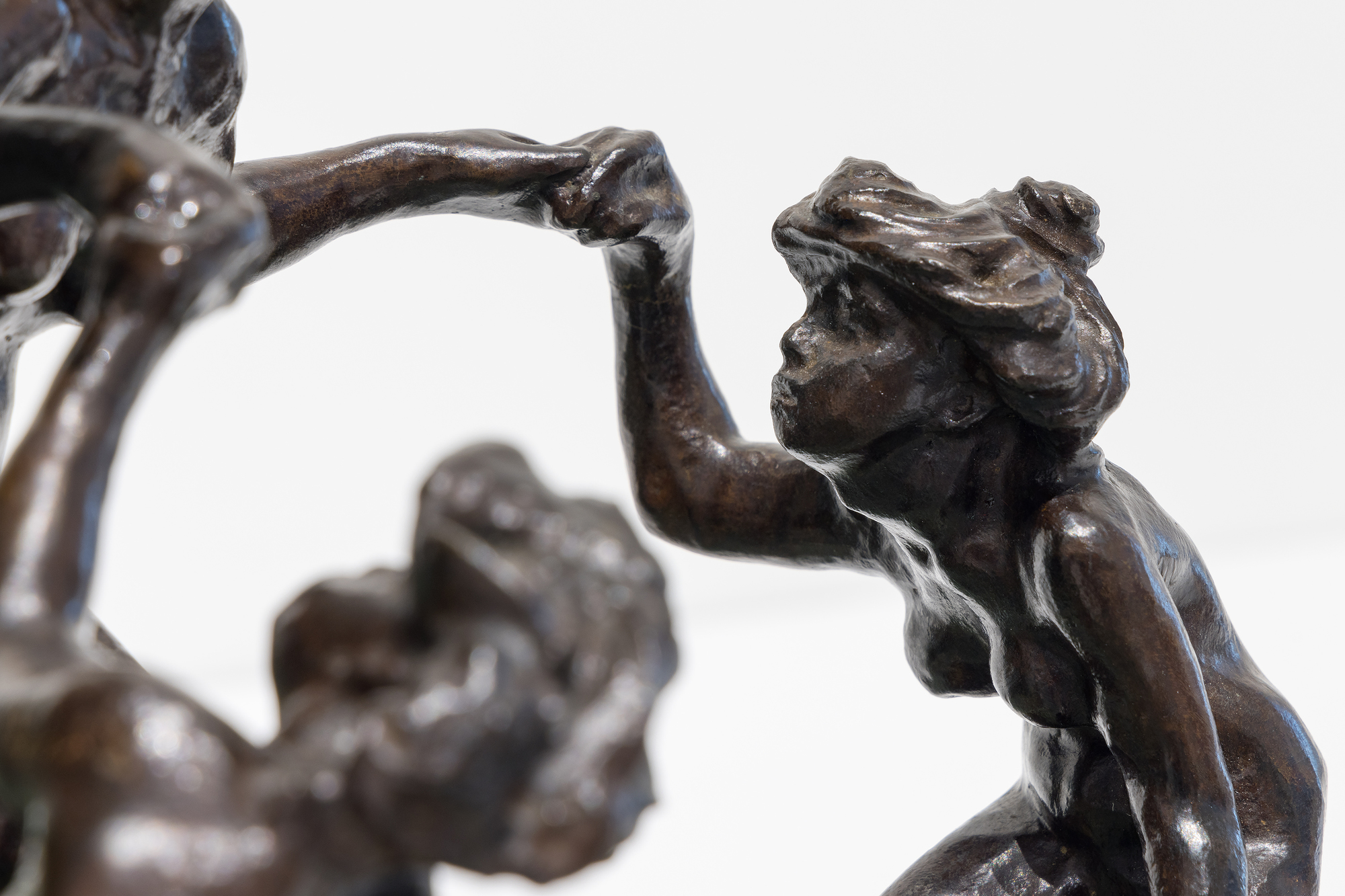 <div><font face=Calibri size=3 color=black>Camille Claudel's life story reflects an era when societal constraints often dimmed the brilliance of women; their genius was viewed as a threat to the male-dominated world. Most introductions to Claudel are steeped in misleading biographical details related to her as Rodin's assistant, mistress, or lover, associations that diminish her achievements as a first-rate sculptor whose work borrows little from Rodin in style or subject matter. Despite these challenges, Claudel's legacy has endured, celebrated through exhibitions, biographies, and films since her rediscovery in 1982. </font></div>
<br>
<br><div> </div>
<br>
<br><div><font face=Calibri size=3 color=black><em>“La Vague (The Wave),”</em> a remarkable sculpture of three women frolicking joyfully, embodies Claudel's passion for art and connection to nature. The women, their hair unruly like the sea, are depicted in a moment of freedom and abandon, yet the looming wave hints at the inevitable sorrow to come—a metaphor for Claudel's life, shadowed by fate. This piece, initially shown in plaster and later cast in bronze with an onyx marble wave, draws direct inspiration from Hokusai's <em>“The Great Wave,”</em> reflecting the Parisian fascination with Japanese art at the time. While <em>“La Vague”</em> showcases Claudel's technical mastery and the influence of Japanese aesthetics, it also poignantly symbolizes her acceptance of the overpowering forces of nature and the tragic course her life would ultimately take. This bronze, cast in 1997, is one of only two not held in a museum, further emphasizing the rarity of and reverence for Claudel's work.</font></div>